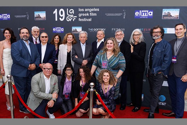 Director Costa-Gavras (in the middle), LAGFF 2025 Honoree; (top row from left to right) LAGFF Board Member and producer Kary Antholis, Festival Director Aris Katopodis, LAGFF supporter and ELMA Founder Pascal Ladreyt, Festival Manager Dimitra Kasdagli, director Michèle Ray-Gavras, director Costa-Gavras, Netflix co-CEO Ted Sarandos, Festival Director of Development Katerina Hoyo-Frederickson, director John Landis, costume designer Prof. Deborah Nadoolman Landis, LAGFF Board Member and producer/director Greg Yaitanes, LAGFF Board Member Alex Kalognomos; (bottom row from left) LAGFF supporter and producer Gareth Ellis-Unwin, Festival Tribute Producer Fay Lellios, Festival Producer Eleni Kafetzi and Festival Co-Founder Ersi Danou